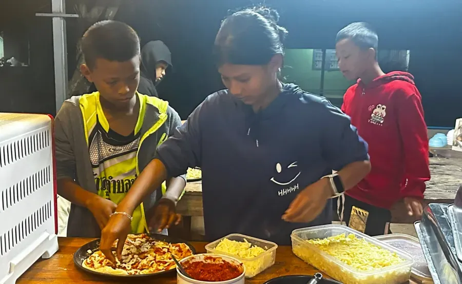 Children making pizza for 2026 new year celebrations at Safe Haven
        Orphanage.